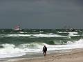 The fishing boat got stuck on the beach and had to be towed away by the rescue ship. Probably the engine broke.